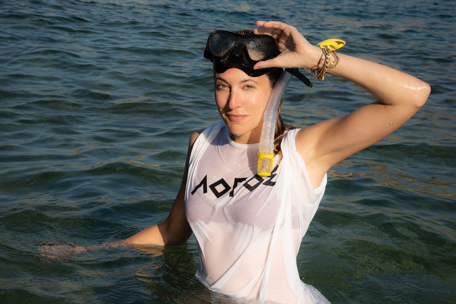 ERMOU CLASSICS 'LOGOS' TEE IN WHITE  - Modeled by Saranna in Mykonos